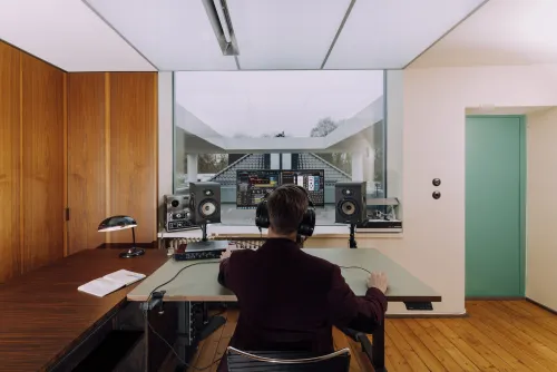 dennis bajer audio immersive engineer wearing headphones at bauhaus studio